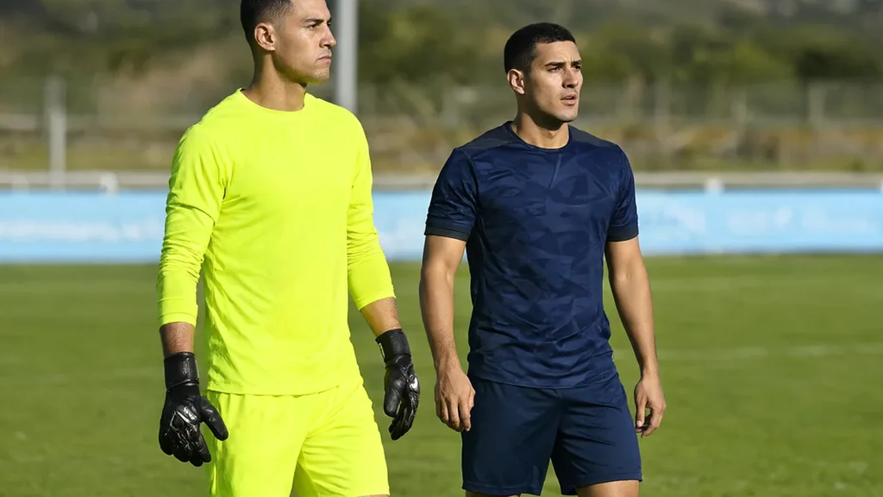 Bright goalkeeper jersey with long sleeves hanging on a hanger