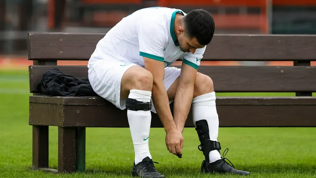 Pair of vivid shin pads lying on bright grass next to football socks